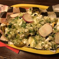 Guac nachos (it’s all underneath don’t be fooled!)  at Momencik in Warsaw