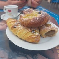 Pastries with pistachio cream, custard and cherry jam, and cream cheese filling and raisins at Fratelli Piermattei in Rome