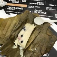 Banana sticky rice in a banana leaf  at King CookDaily in East London