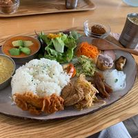 Veggie curries and vegan mango lassie at Dechibica in Yomitan