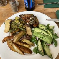 Potatoes stir fried vegetables tofu and citrusy salad  at Robin Food in Amsterdam