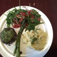 Main dish : grilled greens, black beans burger with pesto, mashed potatoes, asparagus, cherry tomatoes salad (Vegan) at Robin Food in Amsterdam