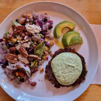 Zucchini fritters with avocado and salad for the main. at Robin Food in Amsterdam