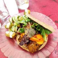 Seitan pita sandwich with house made cheese! Potatoes with pesto and mayo. at La Camelia Vegan Bar in Bilbao