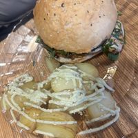 Burger with baby potato side   at La Camelia Vegan Bar in Bilbao