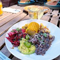 Spicy Mexican Bowl - bittersweet purple cabbage, scrambled tofu, black beans stew, raw salad, sprouts, roasted white potato, avocado and pesto.  at FOAM in The Hague