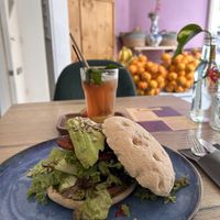 Blta sandwich with tempeh ‘bacon’ and rhubarb lemonade in the back  at FOAM in The Hague