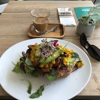 Scrambled tofu with tempeh bacon and greens! Yummy!!! at FOAM in The Hague