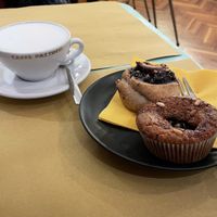 Rice-almond milk cappuccino, chesnut and sour cherry muffin and a sweet roll at Sweet Irene in Bergamo