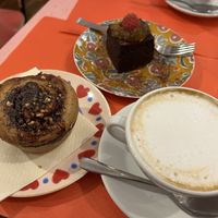 Coconut milk cappuccino with chocolate cheesecake and kind of cinnamon  at Sweet Irene in Bergamo