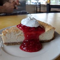 Vanilla cheesecake with raspberry compote and whipped cream at Bean Vegan Cuisine in Asheville