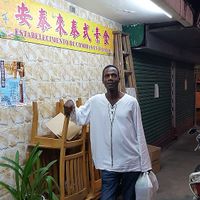 In front of On Thai Loi with my take-out order at Thai Vegan 安泰來泰式素食 in Macau