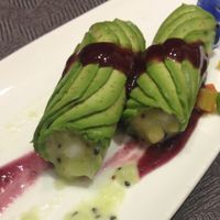Avocado-wrapped dragon fruit with blueberry sauce. at Huā Kāi SùShí 花开素食 - Dongcheng in Beijing