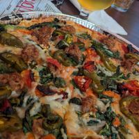 The BEST GF crust. BEST vegan pizza. I did the vegan sausage, sundried tomatoes, spinach, garlic, and jalapenos with vegan cheese 🤤 good gracious hallelujah 🏆 they also have  at Pizza Artista in Lafayette