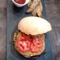 Main courses / Veggie burger with potato wedges at Botanique in Madrid