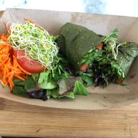 “Raw Wrap” marinated mushrooms with salad fixings.  Tortilla made from apples and spinach.  A beautiful low-fat raw concept!  Would love to see more options like this! at Plant Theory in Miami