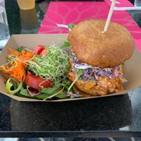 Guava BBQ Jackfruit sandwich with a salad at Plant Theory in Miami