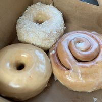 My haul! Glazed, coconut and cinnamon roll flavors 😋  at Destination Donuts in Columbus