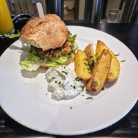 Lentil Burger with XL potato wedges at Olive in Innsbruck