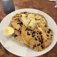 Vegan blueberry filled pancakes with bananas and chocolate chips w/ a side of vegan chorizo sausage! 🔥🔥🔥 Definitely going back to try their other vegan options! 😋   at Maywood Pancake House in Maywood