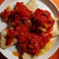 Tofu glassato servito con sugo di pomodoro, olive e capperi (al sapore di mare!) at Spinno in Palermo