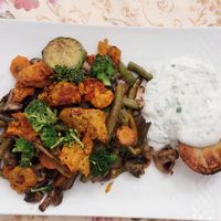 Grilled seitan with vegetables and plantbased sour cream at Pure Vegetarian Cuisine in Tehran