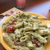 Delicious home made gluten free pesto pasta with cherry tomatoes   at Loving Hut in Sofia