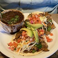 hot as hell tacos with side of black beans.   at Crossroads Cafe in Joshua Tree