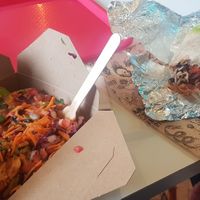 Fully loaded vegan nachos and a massive (half eaten) vegan burrito at Listo Burritos in Manchester