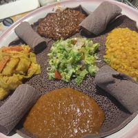 Listed as vegetarian/vegan on the menu, the combo platter is vegan and feeds 2-4 people easily!  You can substitute the injera (bread) for gluten-free as well!   at Queen of Sheba in Spokane