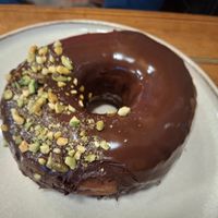 September 2025 - Chocolate and pistachio doughnut (vegan) at Holy Donut in Kaunas