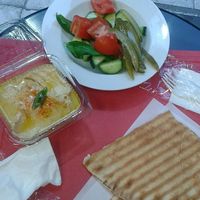 Hummus with salad and pita bread at Enjoy Just Falafel  in Athens