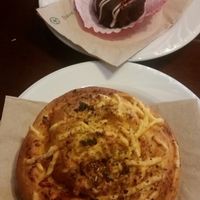 Pizza bun and red velvet mini cake purchased from Bonchaz cafe at Vogue Cakes in Vancouver