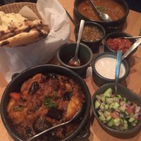 Garlic naan, eggplant potato curry, ";lamb"; rogan josh, and sides  at Green Mushroom in Newtown