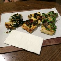 small samples of 3 of the 5 different vegan pizzas they had last time I was there. (you can pick the size, they'll cut it) at Unter Freunden in Heidelberg