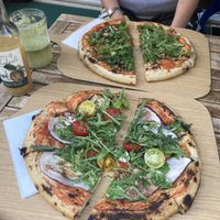 Funghi and eggplant vegan pizza with juice  at Unter Freunden in Heidelberg