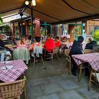 Outdoor seating at La Malga Ristorante Pizzeria Vionteca at La Malga Ristorante Pizzeria Vinoteca in Berlin