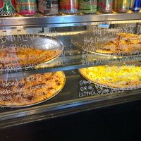 Ready made pizzas by the slice  at Apiecalypse Now Pizza and Snack Bar in Toronto