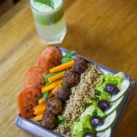 The Buddah Bowl with a detox juice. I'm a traveling photographer and thought I'd snap a shot of my bowl for Prem. They're really amazing people doing incredible things for the community! at Prem Vida - Alimentación Consciente in Sucre