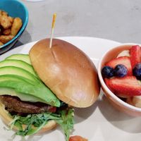 Shamrock sandwich with an extra side of potatoes. at The Bossy Hen in Myrtle Beach