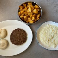 Poached egg, home fries, sausage and grits   at The Bossy Hen in Myrtle Beach