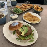 Sausage sandwich, hash browns, home fries,  and chick'n & waffles.  at The Bossy Hen in Myrtle Beach