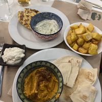 Potatoes, hummus and tzatziki   at Mama Tierra in Athens