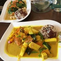 Delicious, cheap and super healthy ananas curry and spinach dish with a side of mixed kinds of rice and tasty tea. at Velvet Leaf in Berlin