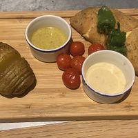 Seitan with’gouda and red pepper centre, hasleback potato and sauces at Teresa Carles Cocina Vegetariana in Barcelona