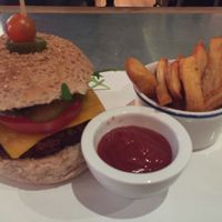 Seitan veggy burguer with potato wedges... Yummy at Teresa Carles Cocina Vegetariana in Barcelona