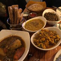 One non-vegan option at bottom left for partner. Rice, dal, mushrooms, cauliflower, and naan all vegan   at Lapis in Washington