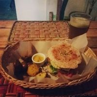 Lentil burguer with avocado, vegan cheese and yellow potatoes on a side ?  at El Jardín de Jazmín in Lima