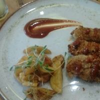 Fried cauliflower nuggets and side dishes at El Jardín de Jazmín in Lima