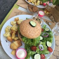Mushroom truffle burger, rosemary potatoes, mushroom crudités and nuggets at Universo Vegano in Florence